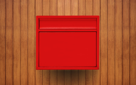 Red mailbox on wooden wallの写真素材