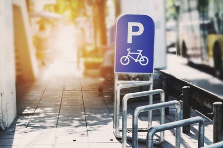Bicycle parked sign tracks in the city, vintage tone with bright lightの写真素材