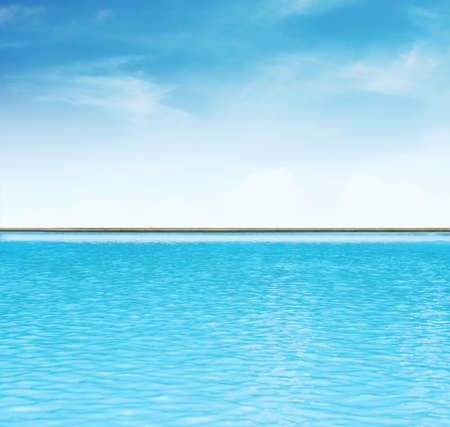 Blue sky and swimming pool waterの写真素材