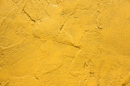 Wall painted in retro yellow textureの写真素材