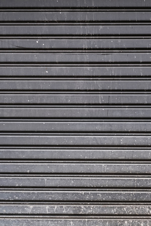 Old steel garage door stripped texture, horizontal linesの写真素材
