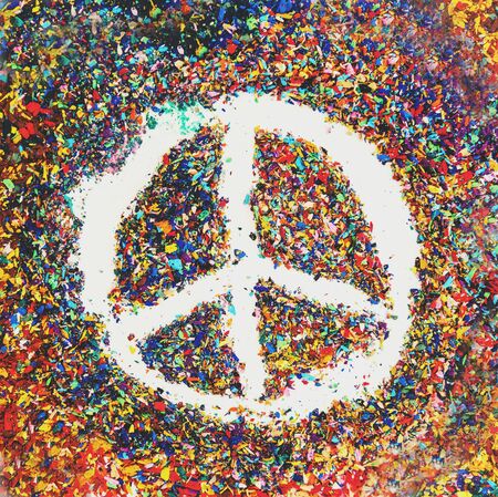 Peace symbol on scraps of colorful pastel oil colorsの写真素材