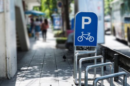 Bicycle parked sign tracks in the cityの写真素材