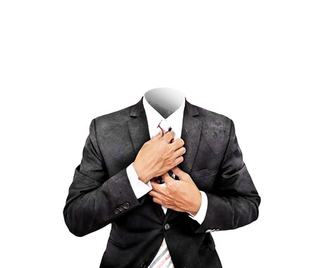 Headless businessman in old antique black suit, isolated on white backgroundの写真素材