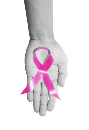 Aids Awareness. pink AIDS awareness ribbon on hand, isolated on white backgroundの写真素材