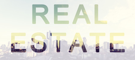 Real Estate Text with Panoramic City Aerial view backgroundの写真素材