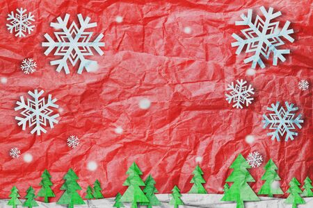 Christmas background, Snowflake with snow and christmas tree, paper cut style made of crumpled paperの写真素材