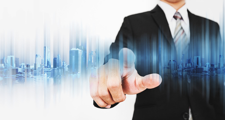Businessman pointing on screen, working with modern technologyの写真素材