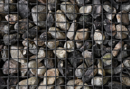 Stones with steel mesh, Gabion wallの写真素材