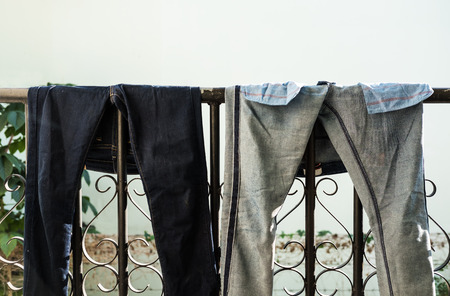Denim jean drying after laundryの写真素材