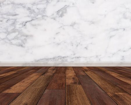Hardwood floor with white marble wallの写真素材