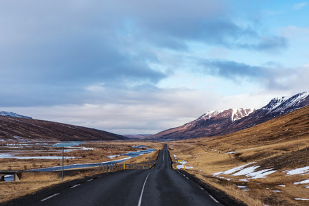 Empty country road in evening before sunset