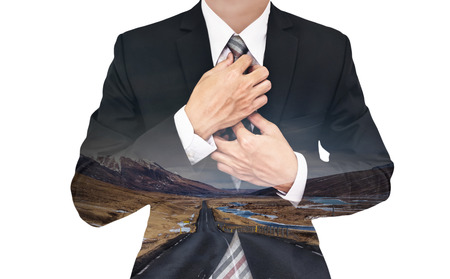 Double exposure businessman with country road in sunset, isolated on white backgroundの写真素材