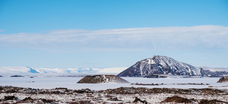 Panoramic landscape, frozen lagoon with mountain in winterの写真素材