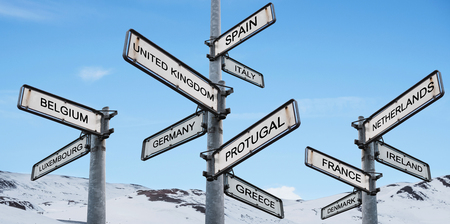 Europe destinations signpost, on blue sky with snow mountain backgroundsの写真素材