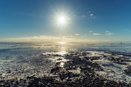 Frozen lake under shiny sun, winter landscapedの写真素材