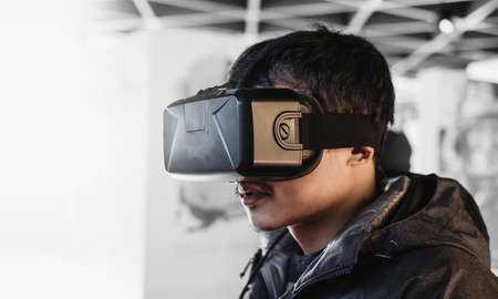 a man wearing VR virtual reality gogglesの写真素材