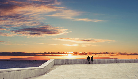 Couple under sunset sky in summerの写真素材