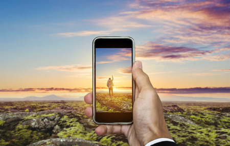 Travel photography by smartphone, traveling and taking photo conceptの写真素材
