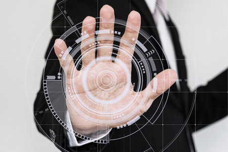 Hand touching futuristic interface screenの写真素材