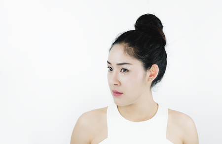 Beautiful Asian Woman with Black Hair, with Healthy Skin, on white backgroundの写真素材