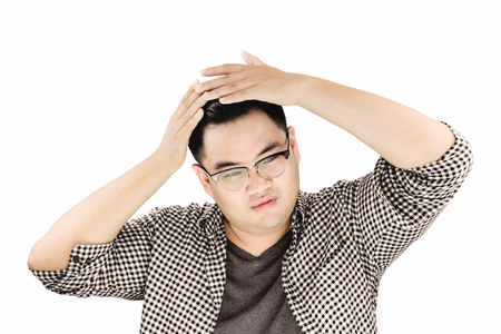 Asian Guy Combing his Hair by hands, isolated on white backgroundの写真素材