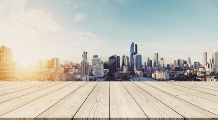Panoramic Bangkok cityscape in sunrise with empty wooden floorの写真素材