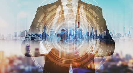 Businessman with city hologram and futuristic technology. futuristic creator business technologyの写真素材