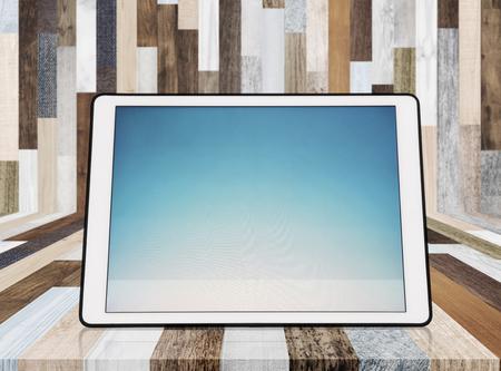 Digital tablet  on wood backgroundの写真素材