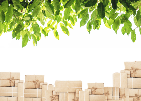 Piles of boxes with green leaf, isolated on white backgroundの写真素材
