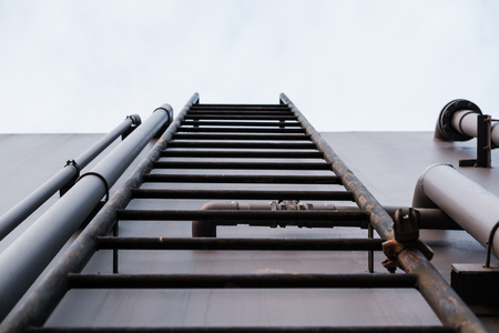ladder on deck with clear blue skyの写真素材
