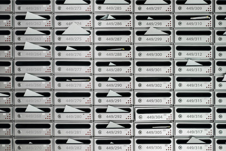 Letterboxes and bills with letters, with room numberの写真素材