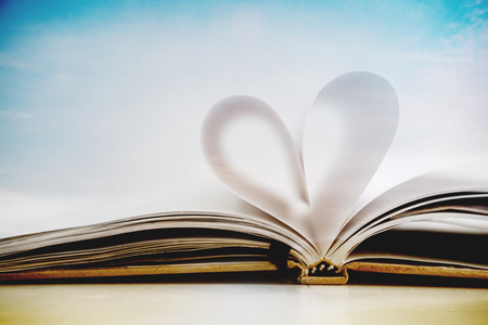 Heart shape on opened notebook page, vintage colors tonedの写真素材