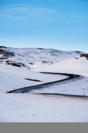 Winter road landscape, with blue clear sky in Icelandの写真素材