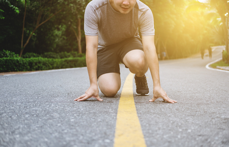 Runner get ready for running on the road, with leading lineの写真素材