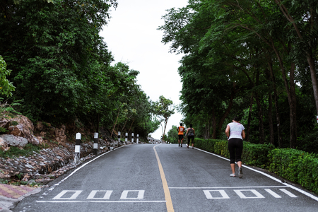 People running on the road in public parks at starting pointの写真素材