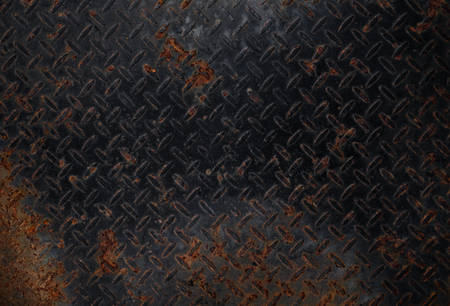 Old rusty black metal plate pattern textureの写真素材