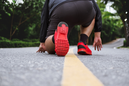 Runner's feet running on the roadの写真素材