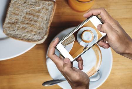 Taking food photo, food photography by smart phone, morning meal with hot coffeeの写真素材