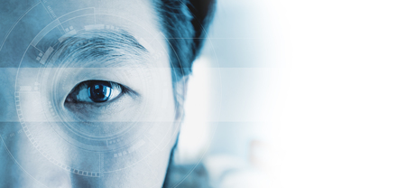 Panoramic close-up Asian businessman's eye , with futuristic technology visual effect, with white copy spaceの写真素材