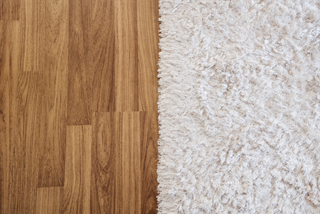 Close-up luxury white carpet on laminate wood floor in living room, interior decorationの写真素材