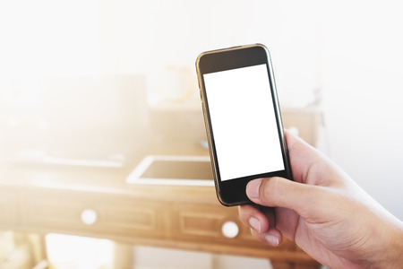 Hand holding Mobile smart phone. Clipping path mobile screenの写真素材