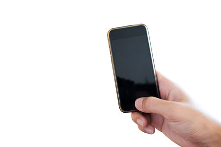Hand holding Mobile smart phone, isolated on white background. Clipping path includedの写真素材