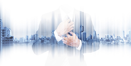 Double exposure businessman with panoramic Bangkok cityspace backgroundの写真素材