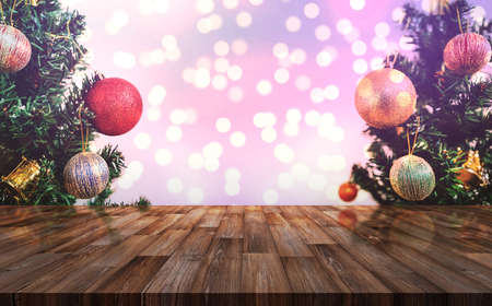 Christmas decoration background. Wooden desk with Christmas tree and Colorful Bokeh lights backgroundの写真素材