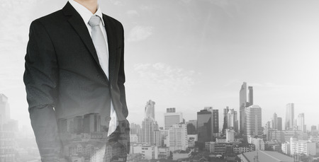 Double exposure, Businessman and city skyscraper view backgroundの写真素材