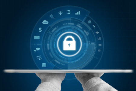 Cyber internet security system. Hand holding digital tablet and security lock technology iconsの写真素材