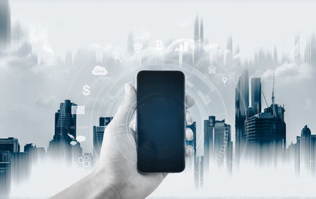 Hand holding mobile smart phone, and technology application technology icons. Mobile application connection technologyの写真素材
