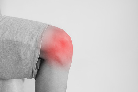 Knee joint pain, a man suffering from knee pain , on white backgroundの写真素材