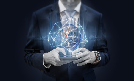 Businessman using mobile smart phone and global network and data connection.の写真素材
